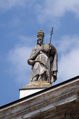 Fototapeta na wymiar Saint Pope Celestine, statue on facade of the Mantua Cathedral dedicated to Saint Peter, Mantua, Italy 