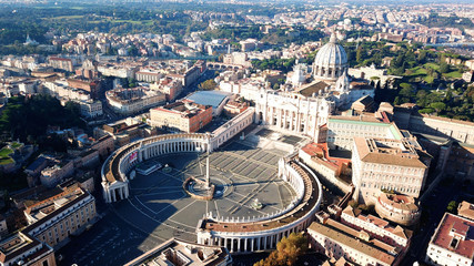 Aerial drone view of Saint Peter's square in front of world's largest church - Papal Basilica of St. Peter's, Vatican - an elliptical esplanade created in the mid seventeenth century, Rome, Italy - obrazy, fototapety, plakaty