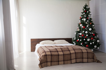 Interior bedroom with bed and Christmas tree new year holidays gifts