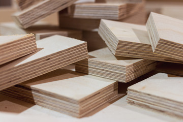 Plywood for industry and construction. Plywood parts. Plywood cuttings for use as texture or background. Plywood boards on the industry.