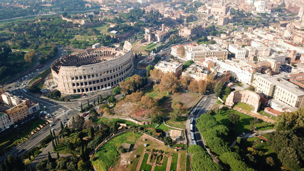 Fototapeta premium Aerial drone view of iconic ancient Arena of Colosseum, also known as the Flavian amphitheatre in the heart of Rome, Italy