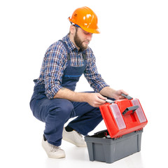 Young man builder with toolbox industry worker hardhat on white background isolation