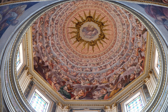 God the Father surrounded by angels fresco painting on the ceiling of the Mantua Cathedral dedicated to Saint Peter, Mantua, Italy 