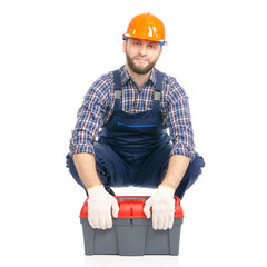 Young man builder with toolbox industry worker hardhat on white background isolation