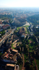 Aerial drone view of iconic ancient Arena of Colosseum, also known as the Flavian amphitheatre in the heart of Rome, Italy