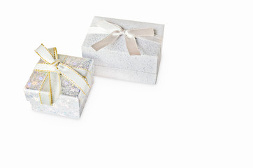 Gift box and copy space for text, decorative background. Seasonal sale. Gift box with jewelry isolated on the white background. Holiday discounts. Selective focus