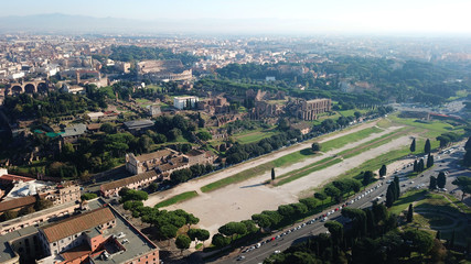 Fototapeta premium Aerial drone photo of iconic Circus Maximus site of an ancient Roman chariot racing stadium and mass entertainment venue next to famous Colosseum, Rome, Italy
