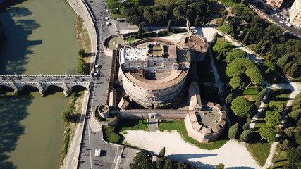 Fototapeta na wymiar Aerial drone view of iconic Castel Sant' Angelo (castle of Holy Angel) and Ponte or bridge Sant'Angelo with statues in river of Tiber next to famous Vatican, Rome, Italy