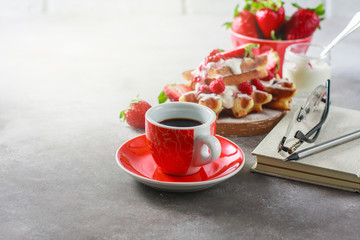 Obraz na płótnie Canvas Belgian waffles with creem, raspberries, strawberriesand coffee , top view with copy space.