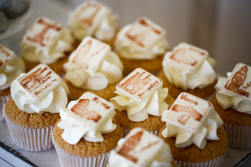 Delicious cupcakes on table
