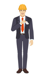 Businessman in construction helmet puts the business-card in his pocket