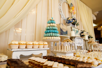 Delicious candy bar with cucakes, cookies and other sweets