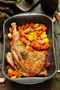 baked turkey thigh with vegetables.