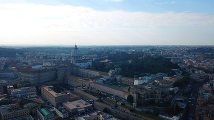 Aerial drone view of Saint Peter's square in front of world's largest church - Papal Basilica of St. Peter's, Vatican - an elliptical esplanade created in the mid seventeenth century, Rome, Italy