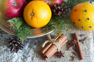 Christmas natural eco ornament with organic fruits on the snowy old table
