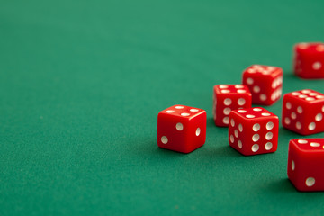 Red dices on green poker gaming table in casino. Concept online gambling. Copy space for text