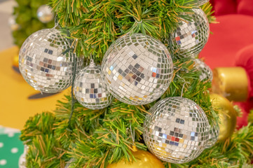 Glass ball ornaments on a Christmas tree.