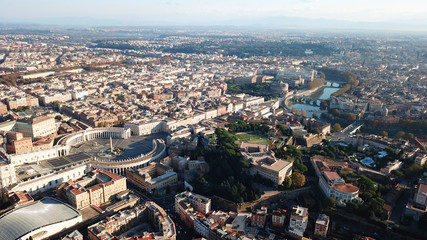 Aerial drone view of Saint Peter's square in front of world's largest church - Papal Basilica of St. Peter's, Vatican - an elliptical esplanade created in the mid seventeenth century, Rome, Italy