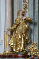 Obraz premium Virgin Mary statue on the altar of Holy Cross in the church of Immaculate Conception in Lepoglava, Croatia