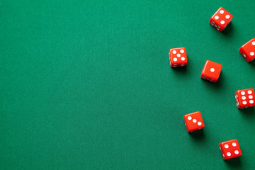 Red dices on green poker gaming table in casino. Concept online gambling. Copy space for text