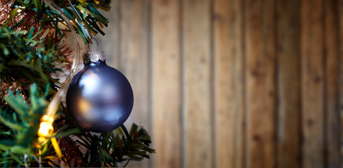 Xmass ball ornement tree against textures wooden wall