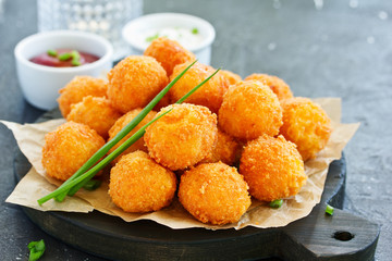 cheese balls with tomato sauce.