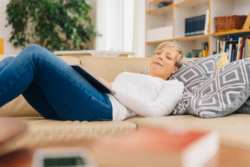 Mature woman relaxing sleeping midday