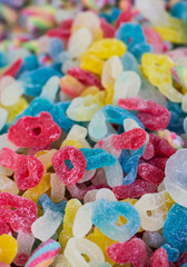 Fototapeta na wymiar assortment colorful gummy candies at market (selective focus)