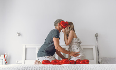 couple love heart on bed