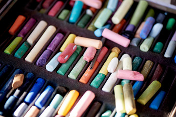 Many different crayons, broken in the work.