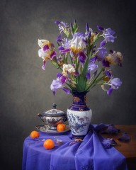 Still life with bouquet beautiful flowers irises © Iryna