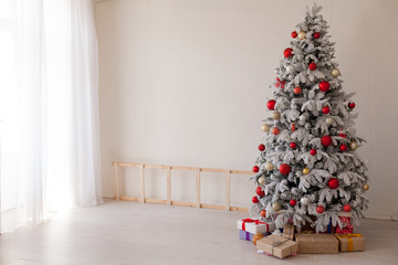 Christmas tree in a room with toys and gifts holiday new year winter postcard