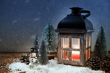 Lantern with Christmas trees. Christmas card.