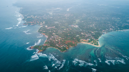 Aerial panorama view of tropical coastline and fisherman village