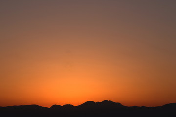 View from Enoshima island to mountain silhouettes with dramatic sunset, Fujisawa, Kanagawa prefecture, Japan