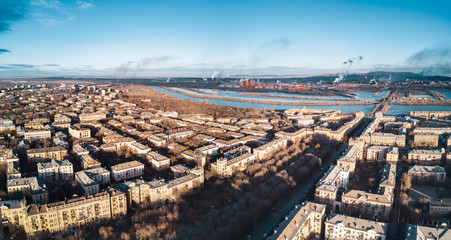 Aerial; drone panoramic view of Magnitogorsk cityscape with old buildings in empire style with decoration elements; beautiful development, architectural complex, parks; polluted single industry city