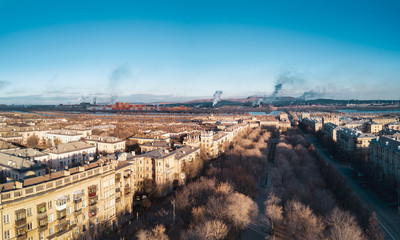 Aerial; drone panoramic view of Magnitogorsk cityscape with old buildings in empire style with decoration elements; beautiful development, architectural complex, parks; polluted single industry city