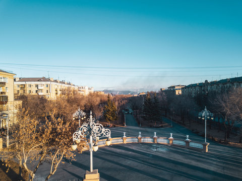 Aerial; drone panoramic view of Magnitogorsk cityscape with old buildings in empire style with decoration elements; beautiful development, architectural complex, parks; polluted single industry city