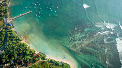 Beautiful aerial view of tropical coastline and fisherman village