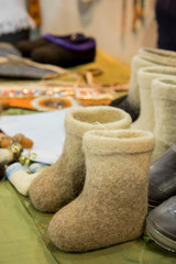 Traditional small kids russian felt boots on trade counter