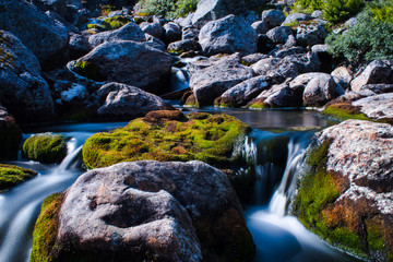 A small waterfall in norway with stones - 234643372