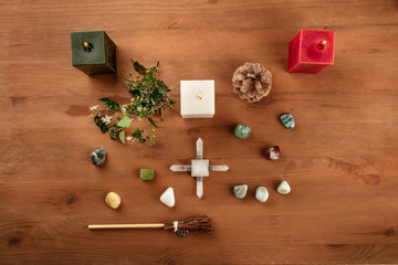 Green Magic. An overhead photo of a Wicca altar with candles, crystal stones, and Norse runes, with...