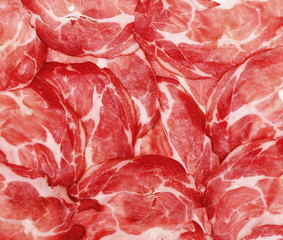 Smoked ham slices background and texture