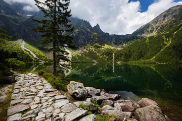 Mountain lake and blue cloudy sky landscape. Morskie Oko lake in Tatra Mountains, Poland © Nickolay Khoroshkov