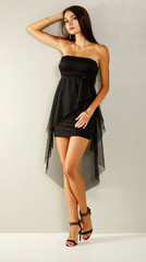 Fototapeta premium Slim young woman in carnival dress and free space for your decoraiton 