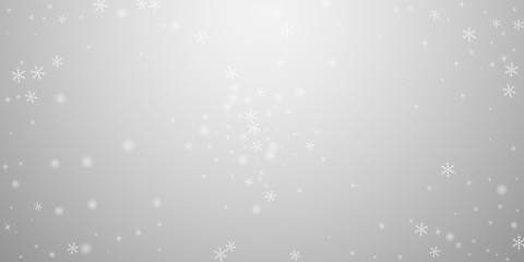 Sparse glowing snow Christmas background. Subtle f