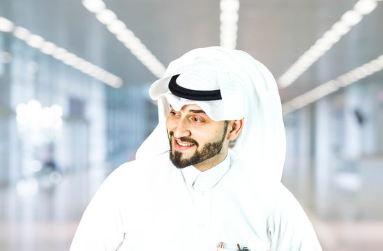 Arabian (Gulf area) smiling man with traditional wear.