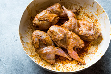 Raw Quail Meat with Sauce Ready to Cook in Bowl.