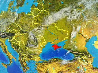 Crimea from space on model of planet Earth with country borders. Extremely fine detail of planet surface and clouds.