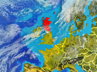 Scotland from space on model of planet Earth with country borders. Extremely fine detail of planet surface and clouds.
